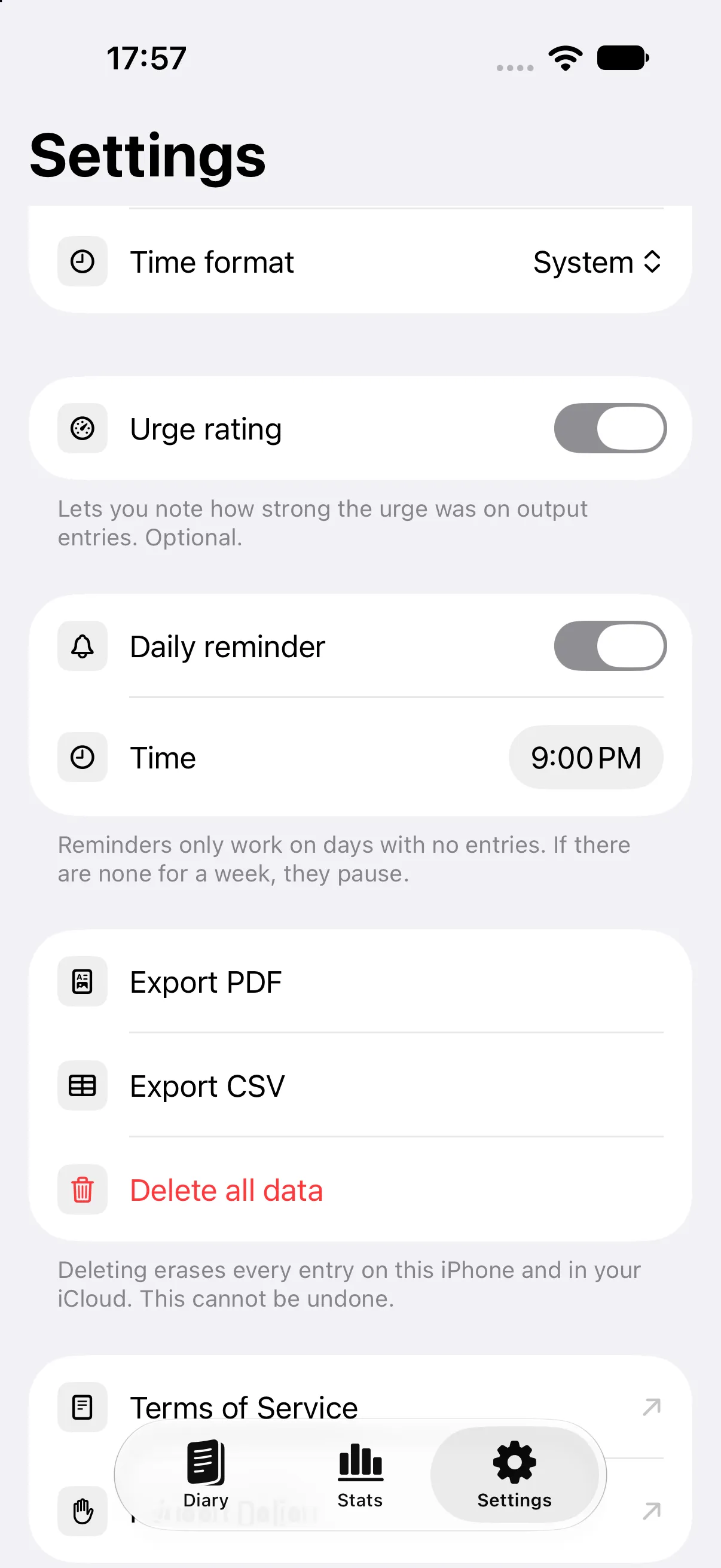 Settings: the reminder fires only on days with no entries, and pauses after a week without any.